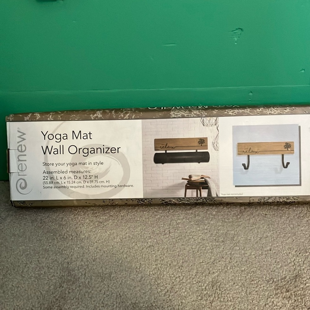 Yoga mat wall organizer